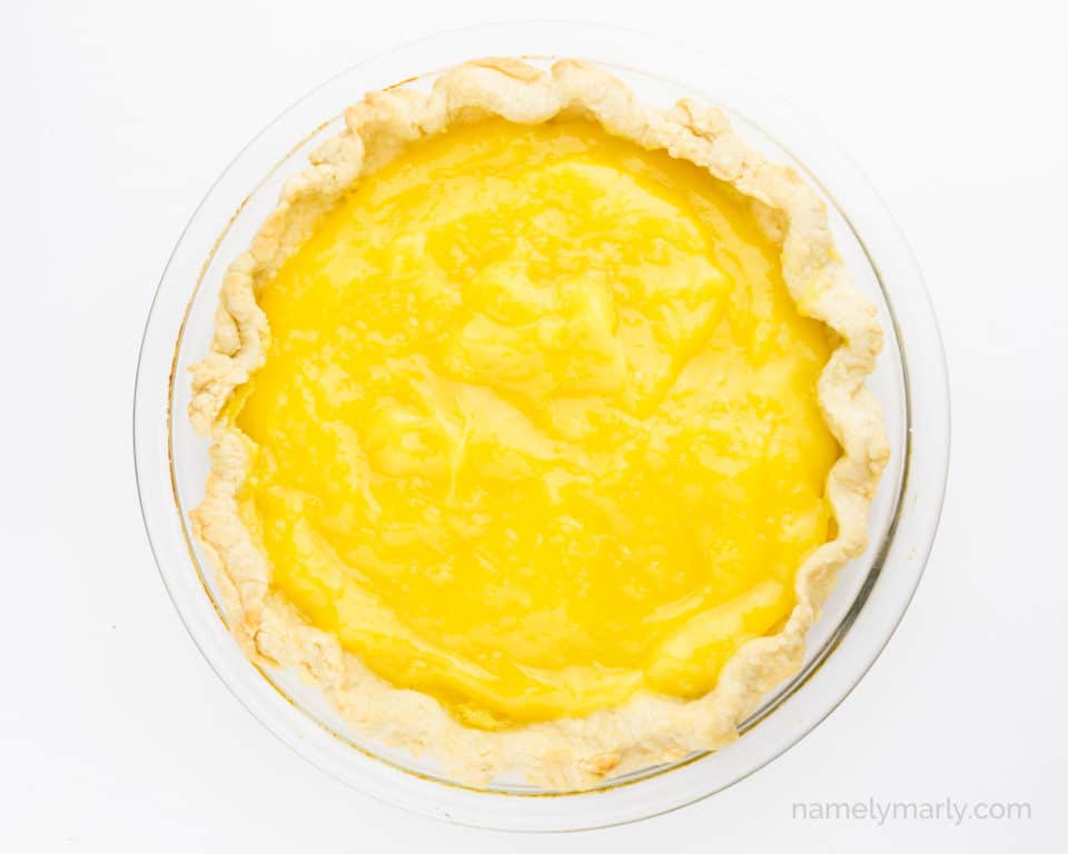 Lemon curd has been poured into a pie shell.